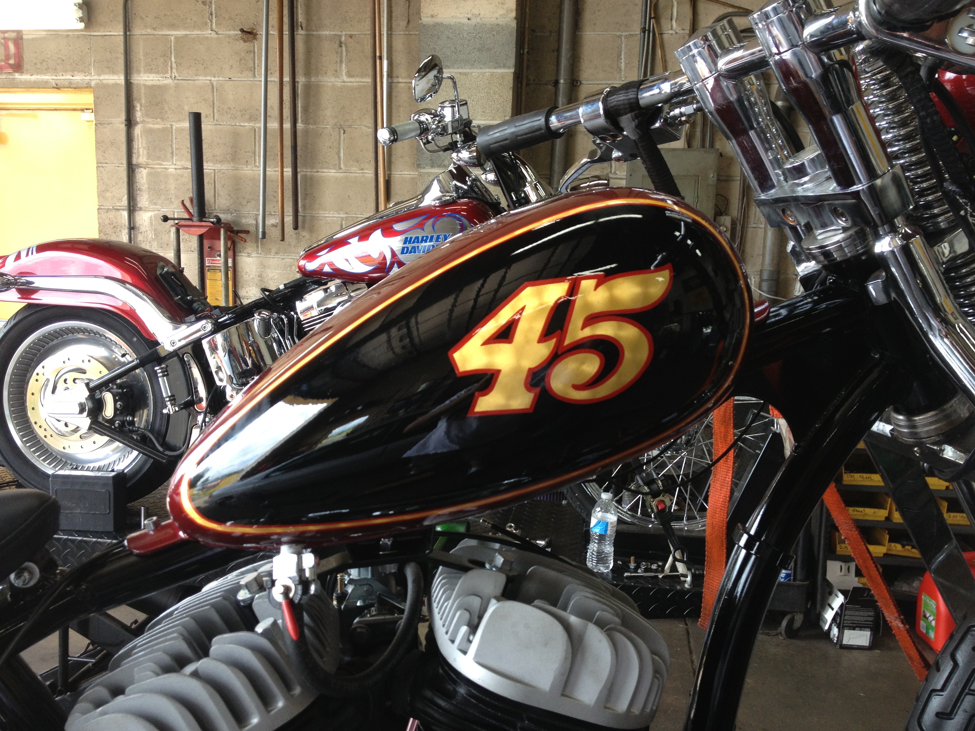 Custom pinstriped number 45 on a motorcycle gas tank