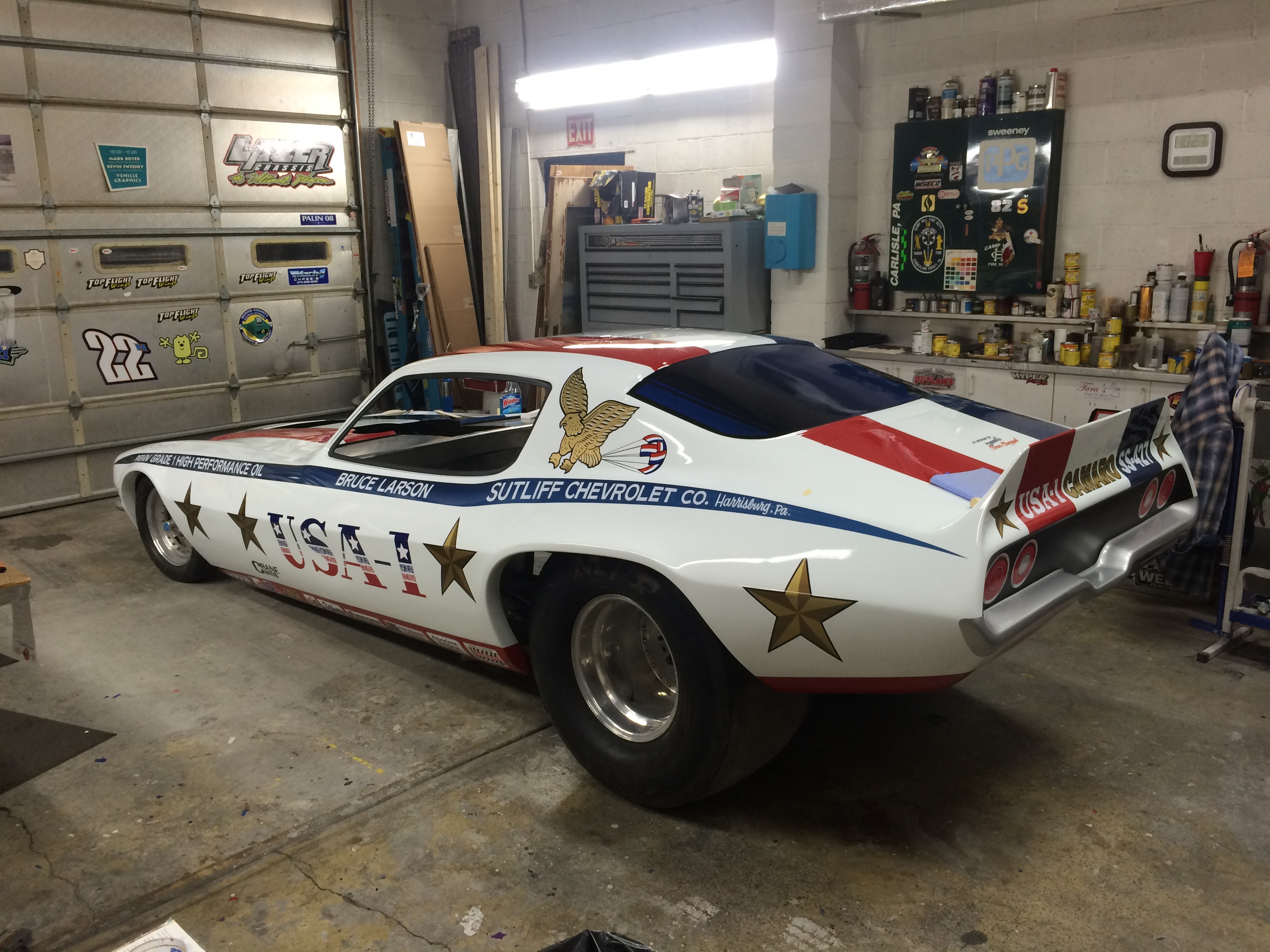 Custom painted eagle and star graphics on a USA-1 funny car body