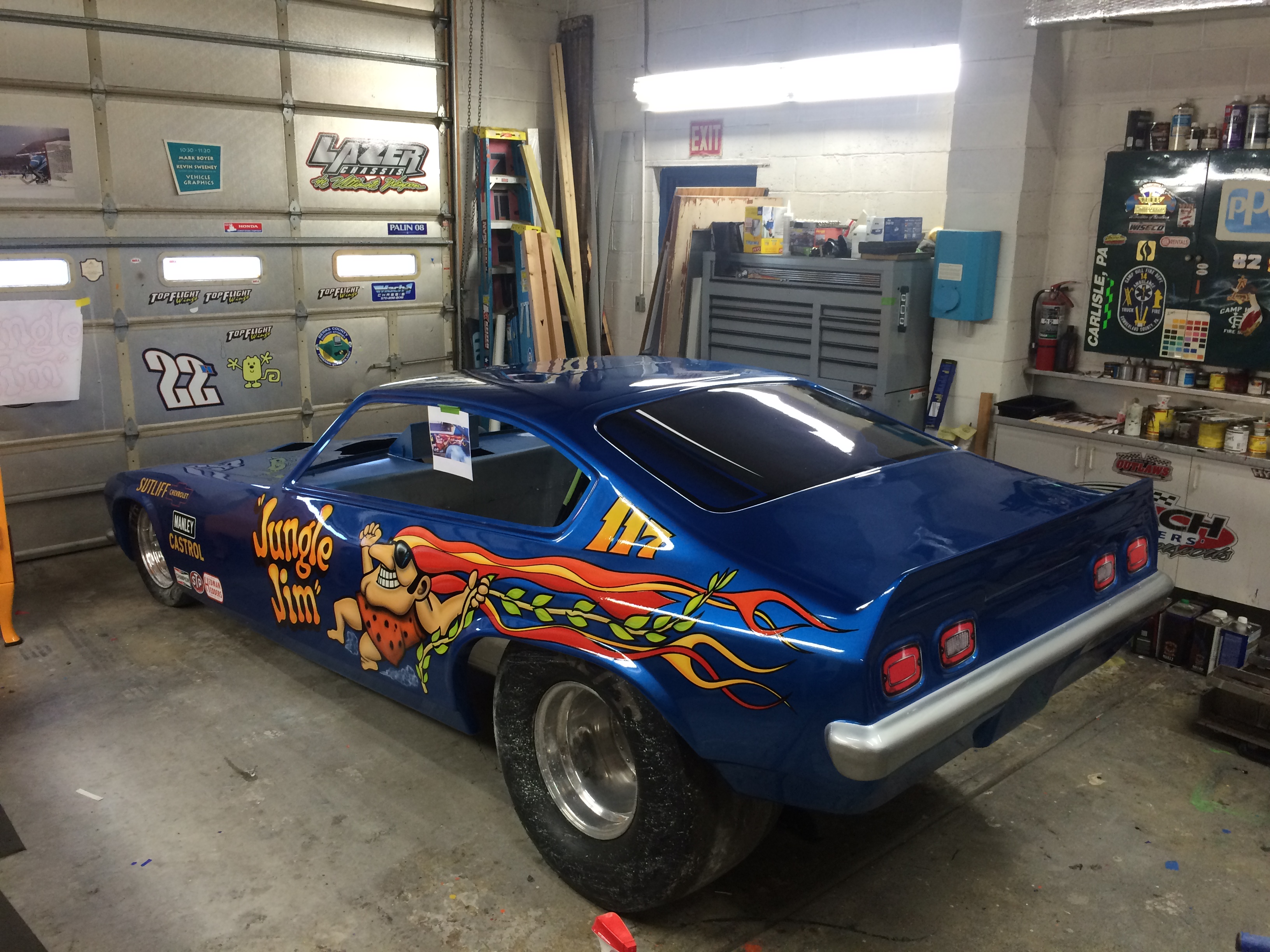 Hand-painted 'Jungle Jim' cartoon character graphics on a drag car