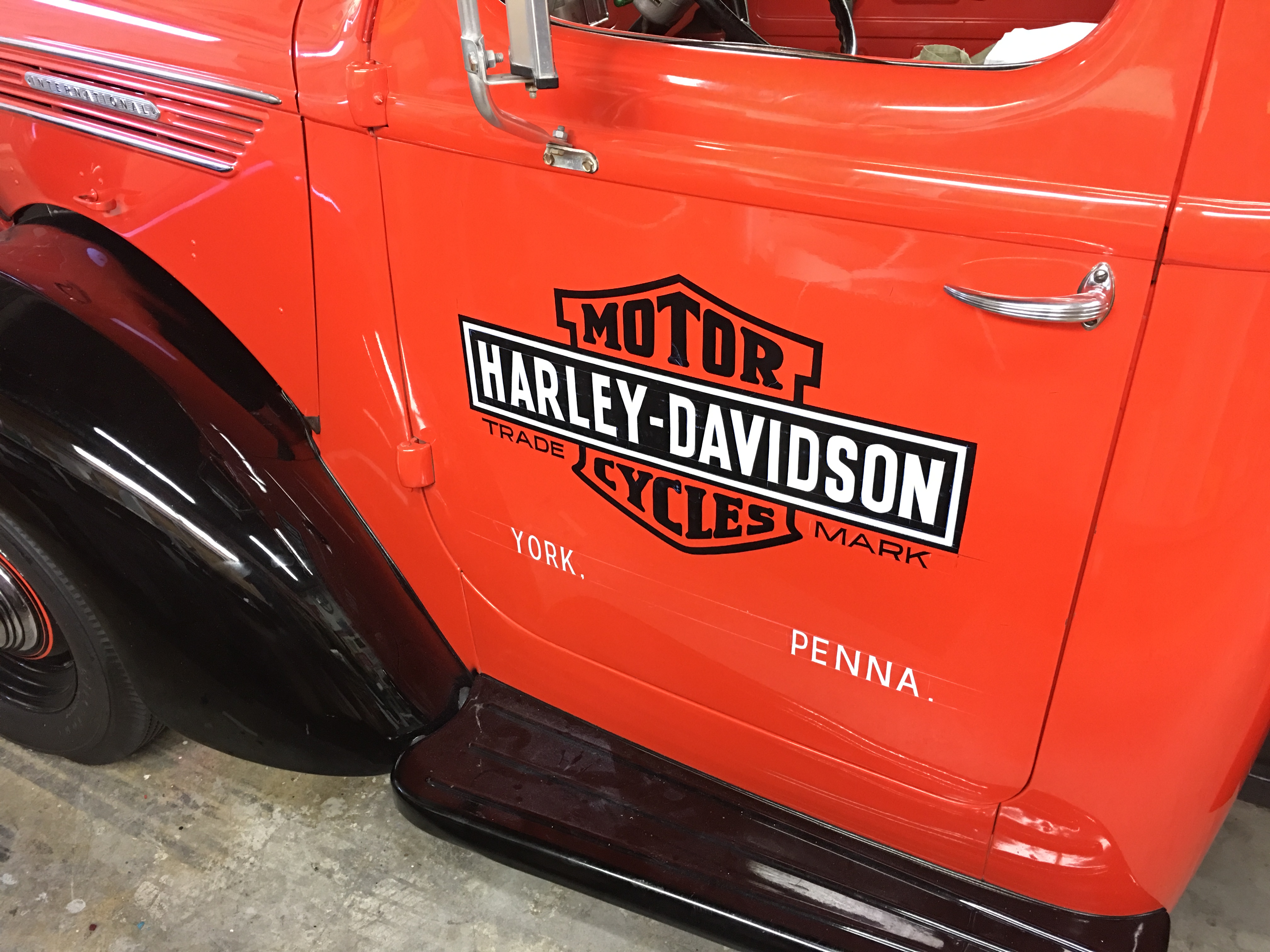 Vintage pickup truck door with Harley-Davidson dealer lettering