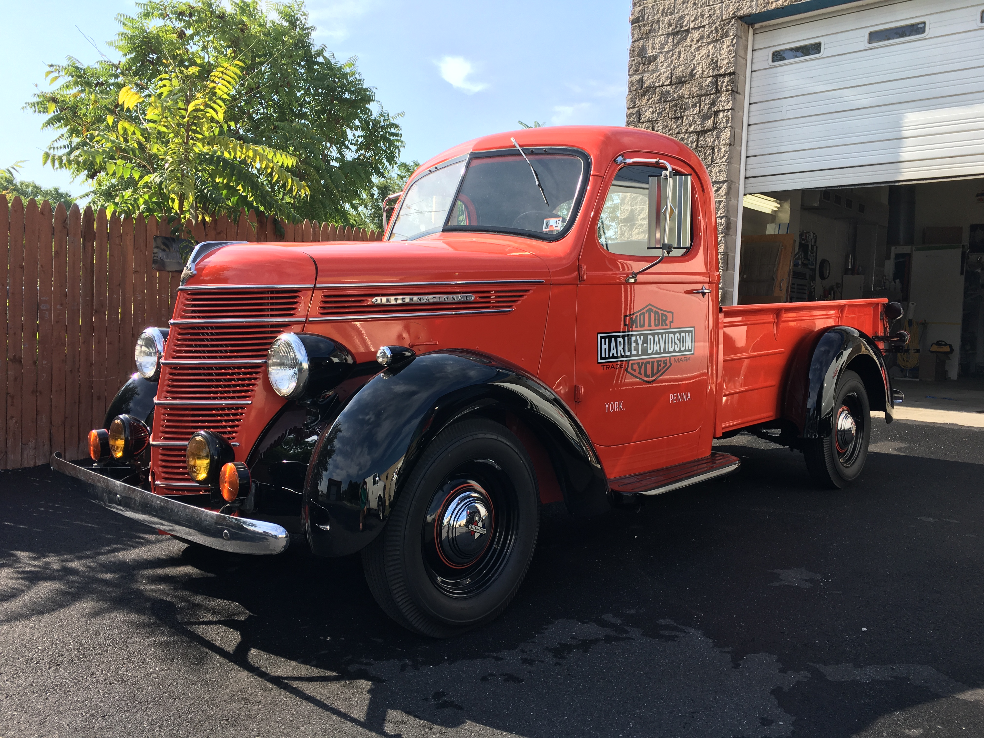 Restored vintage International pickup truck with Harley-Davidson dealer graphics