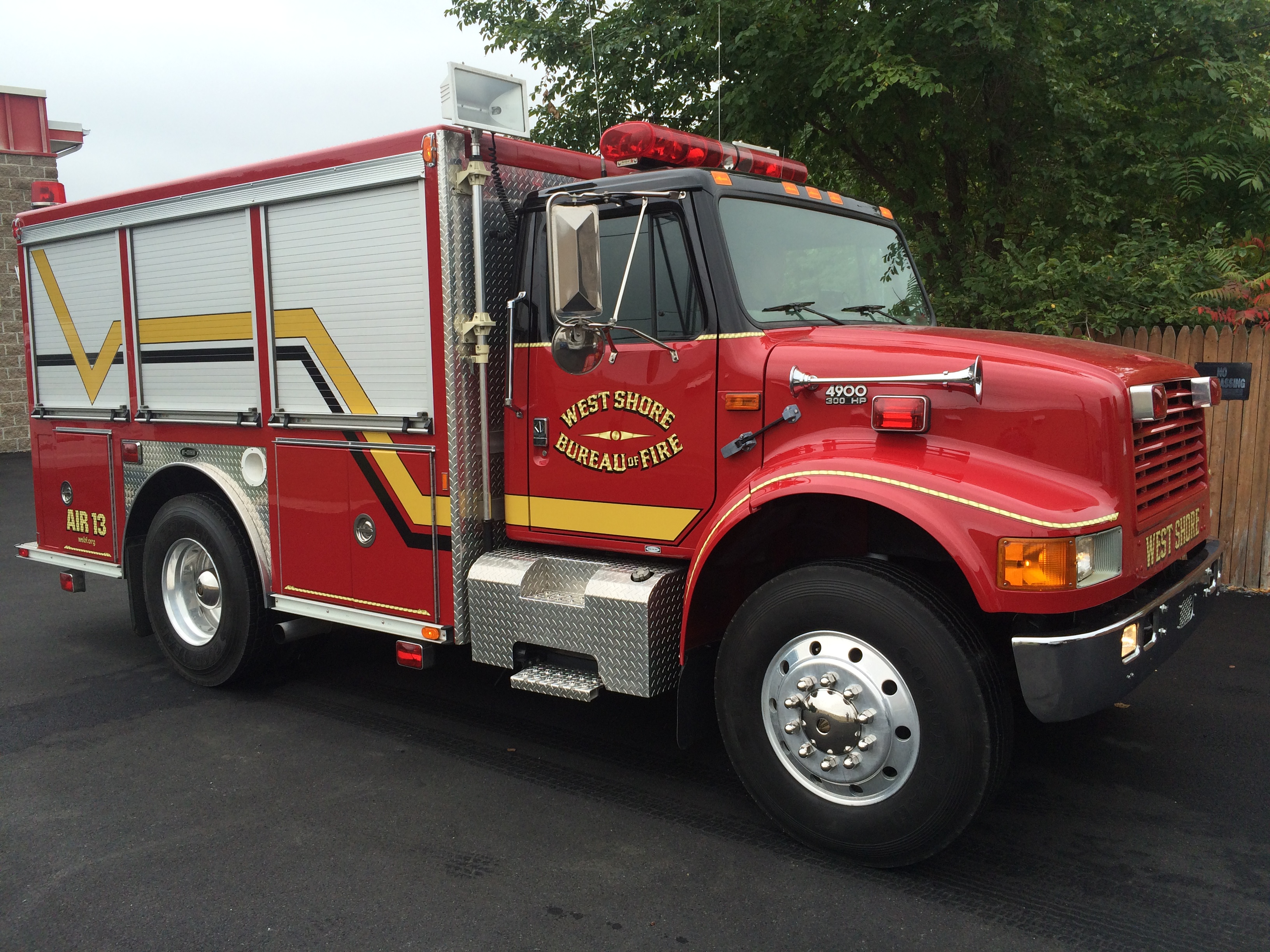 Fire department rescue truck with custom vinyl lettering and striping