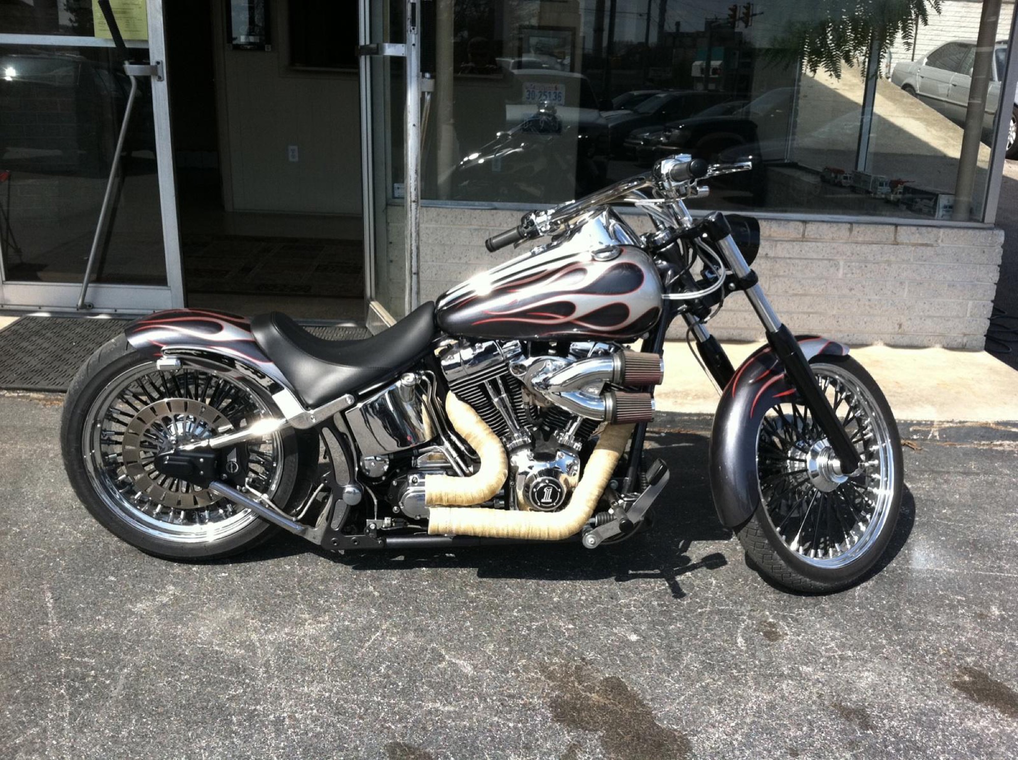 Custom hand-painted flame graphics on a motorcycle fuel tank