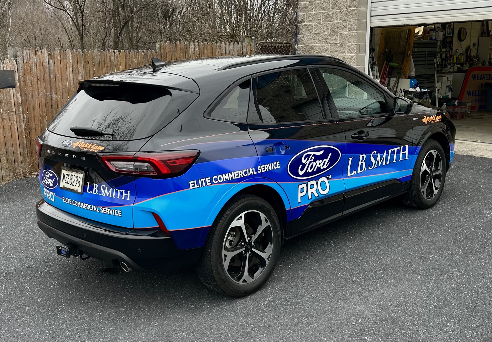 Ford Escape with full commercial vinyl wrap for L.B. Smith Ford