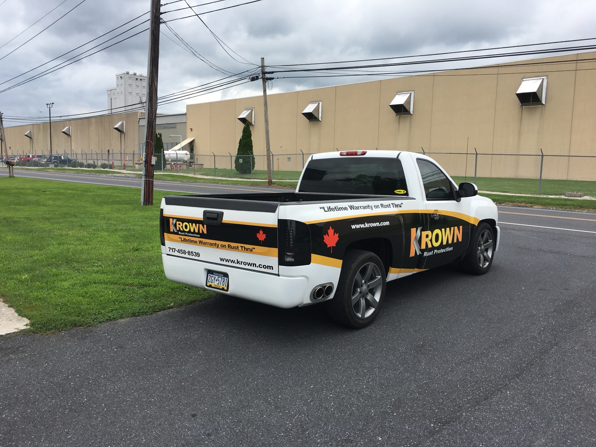 Fully wrapped commercial work truck with branded graphics and lettering, Sweeney Signs