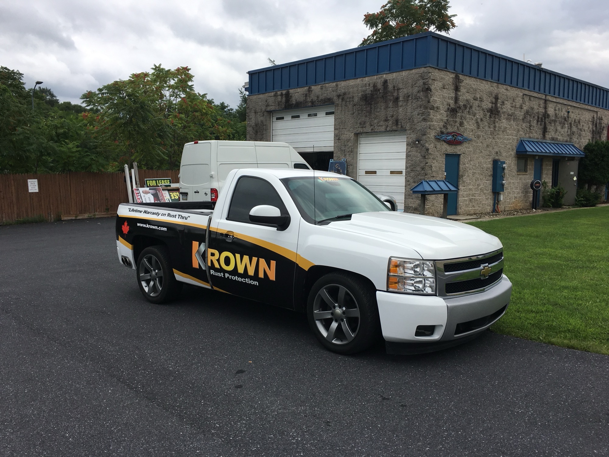 Commercial pickup truck with vinyl wrap and lettering