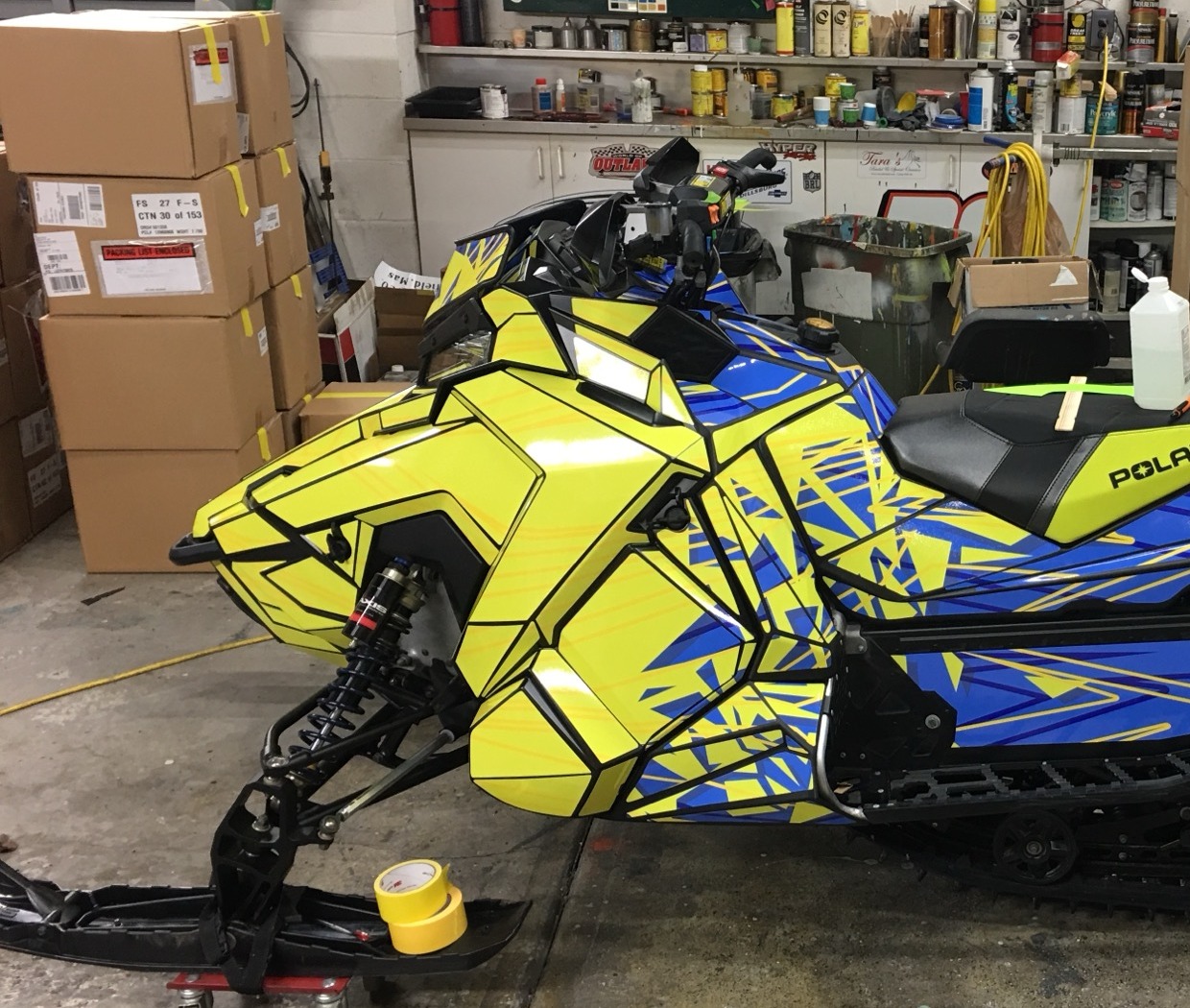 Close-up of vinyl decal graphics on a snowmobile